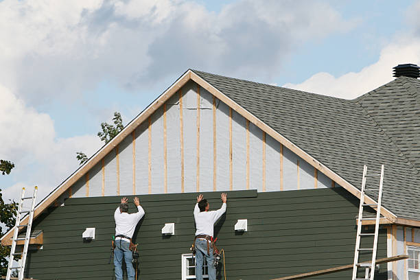 Professional Storm Damage Siding Repair technician working in Farmville, NC